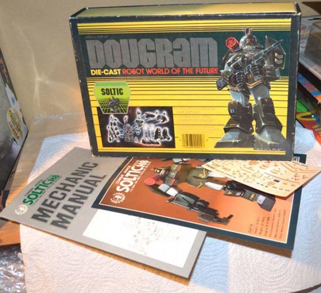 TAKARA DOUGRAM DIE CAST ROBOT WORLD OF THE FUTURE: TAKARA DOUGRAM DIE CAST ROBOT WORLD OF THE FUTURE (CR). FULLY ARTICULATED FOR REAL ACTION, UNIQUE ZINC ALLOY SUSPENSION DESIGN. FIGURE MEASURES ABOUT 6.5" TALL.MINT IN BOX. COMPLETE AND INTACT