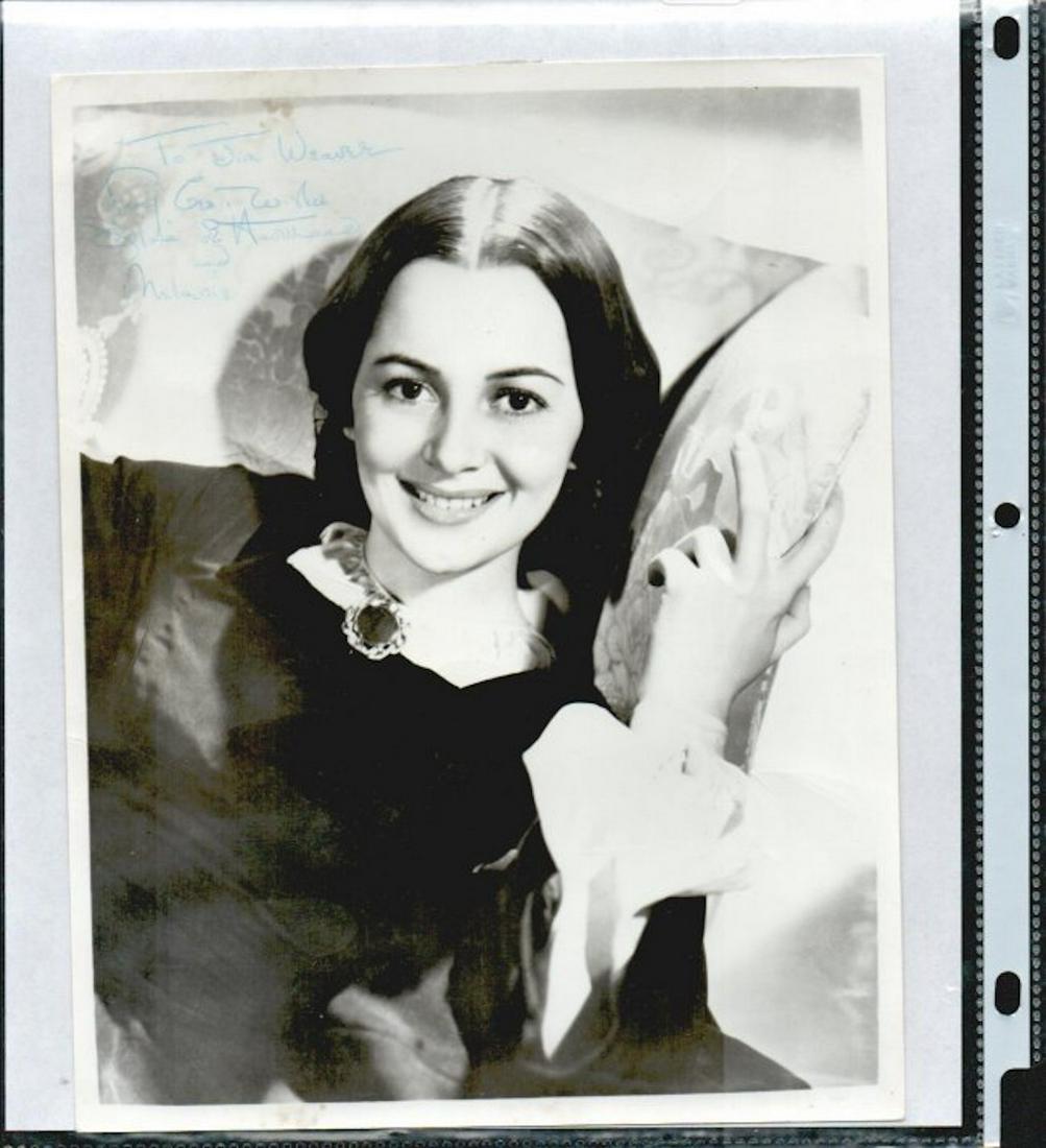 OLIVIA DE HAVILLAND SIGNED 8 X 10 PHOTOGRAPH: OLIVIA DE HAVILLAND SIGNED 8 X 10 PHOTOGRAPH PERSONALIZED "TO JIM WEAVER WITH BEST WISHES FROM OLIVIA DE HAVILAND AND MELANIE." COMES WITH A STATEMENT OF PROVENANCE FROM THE ORIGINAL EBAY SELLER GUARA