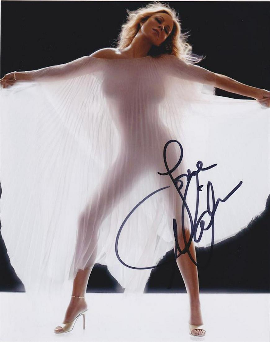 Mariah Carey - 8 X 10 Signed Photograph W/COA: Mariah Carey - 8 X 10 Signed Photograph W/COA. A color satin finish photograph signed in black felt tip ink by Mariah Carey. In good condition. Comes with COA from Todd Mueller Autographs