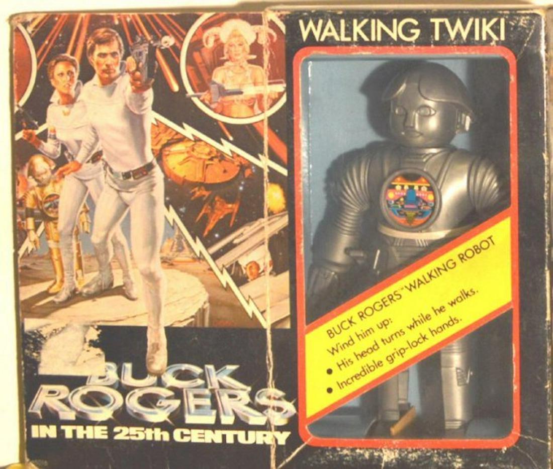 BUCK ROGERS WALKING "TWIKI" ROBOT: BUCK ROGERS WALKING "TWIKI" ROBOT.MEASURES AT 8" TALL."WIND HIM UP: HIS HEAD TURNS WHILE HE WALKS. INCREDIBLE GRIP-LOCK HANDS." (WINDOW SHELF)