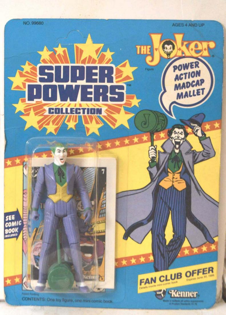 SUPER POWERS "THE JOKER" ACTION FIGURINE ON CARD: SUPER POWERS "THE JOKER" ACTION FIGURINE ON CARD. PART OF SUPER POWERS COLLECTION. NEW AND NEVER USED. THE CARD IS "UN-PUNCHED." IT SHOWS SOME AGING. THE FIGURINE IS IN MINT CONDITION.