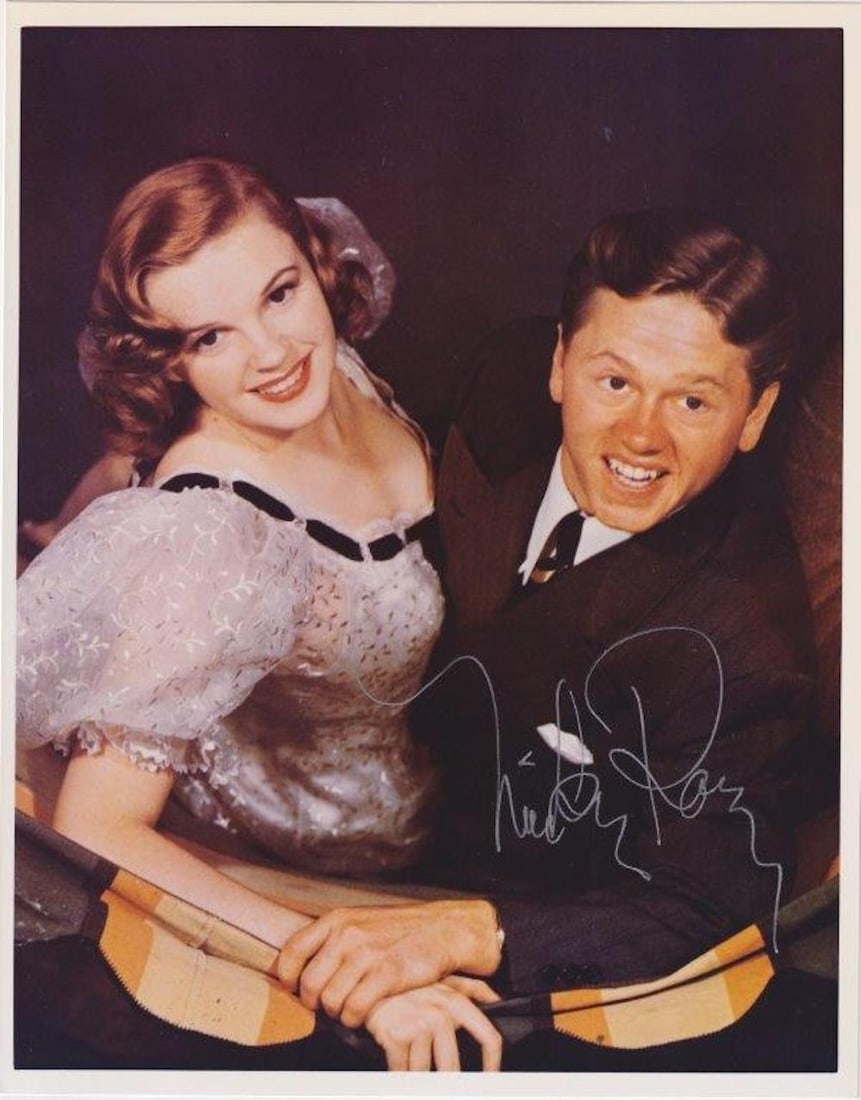 Mickey Rooney - 8 x 10 Signed Photograph w/COA: Mickey Rooney - 8 x 10 Signed Photograph w/COA. Color glossy photograph of Mickey Rooney with Judy Garland signed in silver ink by Mickey Rooney. In good condition.