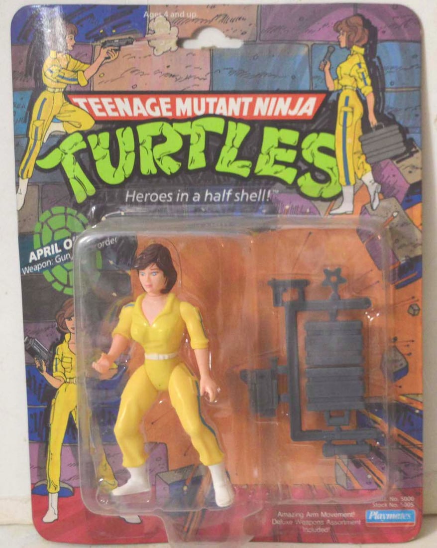 TEENAGE M.N.T. "APRIL O'NEIL, WEAPON GUN/CAMCORDER": TEENAGE M.N.T. "APRIL O'NEIL, WEAPON GUN/CAMCORDER" ACTION FIGURINE ON CARD. NEW. THE CARD IS "PUNCHED." THE CARD SHOWS SOME AGING. THE FIGURINE IS IN MINT CONDITION.
