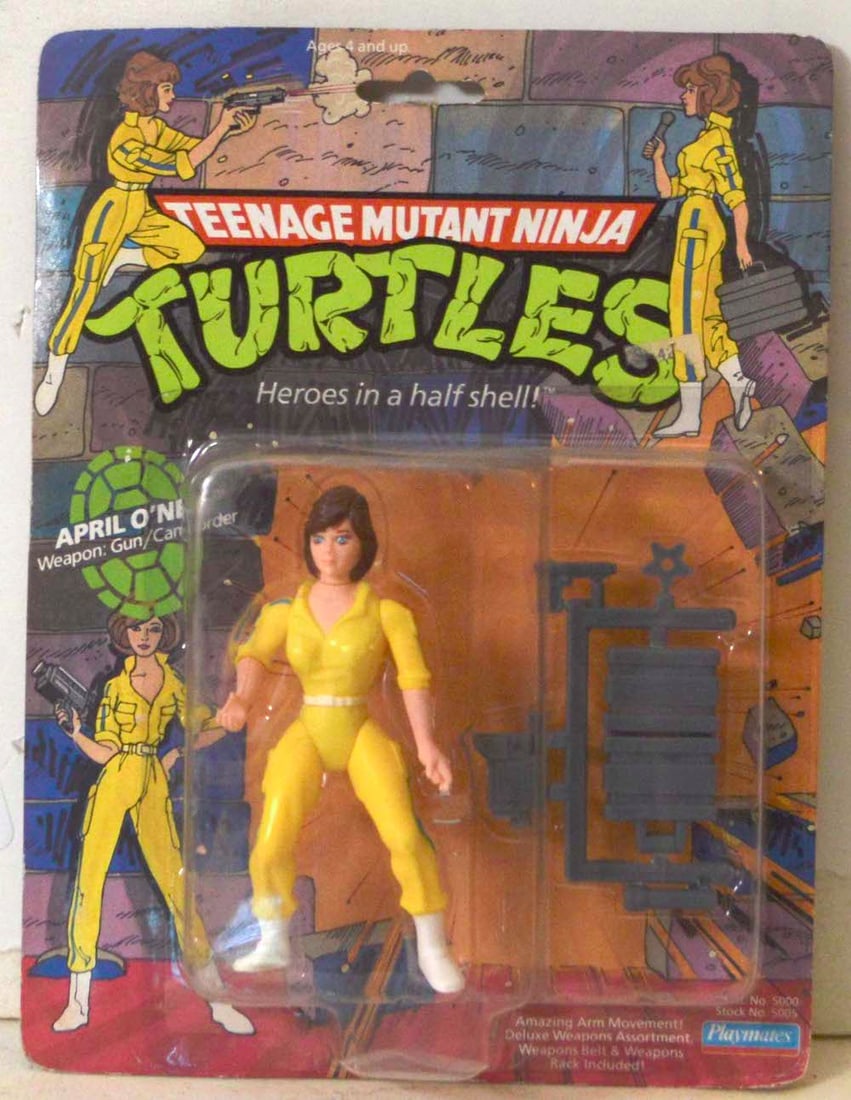 TEENAGE M.N.T. "APRIL O'NEIL, WEAPON GUN/CAMCORDER": TEENAGE M.N.T. "APRIL O'NEIL, WEAPON GUN/CAMCORDER" ACTION FIGURINE ON CARD. NEW. THE CARD IS "PUNCHED." THE CARD SHOWS SOME AGING. THE FIGURINE IS IN MINT CONDITION.