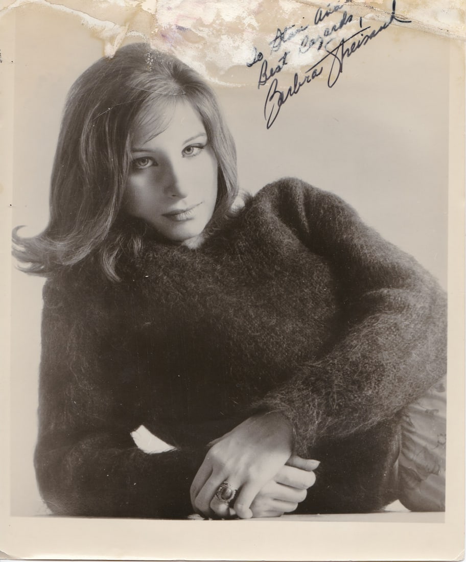 Barbera Streisand - 8 x 10 Signed Photo w/COA: Barbera Streisand - 8 x 10 Signed Photo w/COA. A sepia glossy vintage photograph of Barbara Streisand. Signed by her. Water damage to the top of the photograph affecting part of her writing and signat