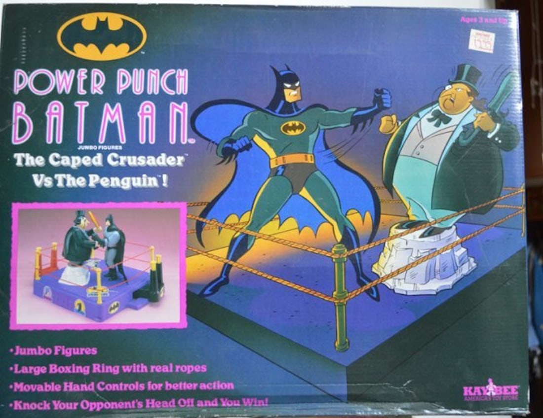 POWER PUNCH BATMAN. THE CAPED CRUSADER VS PENGUIN!: POWER PUNCH BATMAN JUMBO FIGURES. THE CAPE CRUSADER VS PENGUIN! BOX INCLUDES: JUMBO FIGURES, LARGE BOXING RING WITH REAL ROPES, MOVABLE HAND CONTROLS FOR BETTER ACTION, KNOCK YOUR OPPONENTS HEAD'S OFF