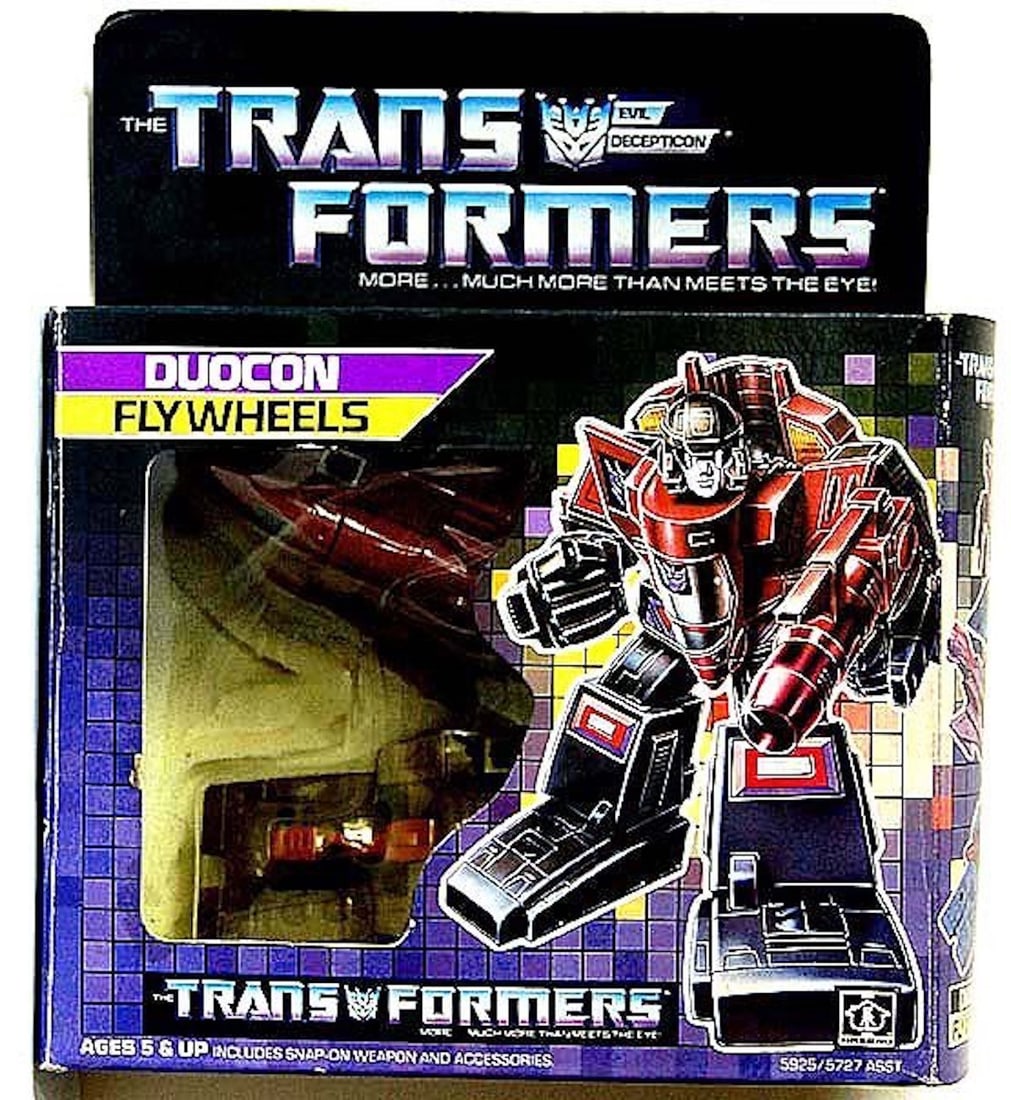 THE TRANSFORMERS EVIL DECEPTION "DUOCON FLYWHEELS": THE TRANSFORMERS EVIL DECEPTION "DUOCON FLYWHEELS." JUST COMBINE THE TANK AND JET AND THEY SPRING INTO A DEVASTATING TWO-VEHICLE ROBOT!" COMPLETE AND INTACT.