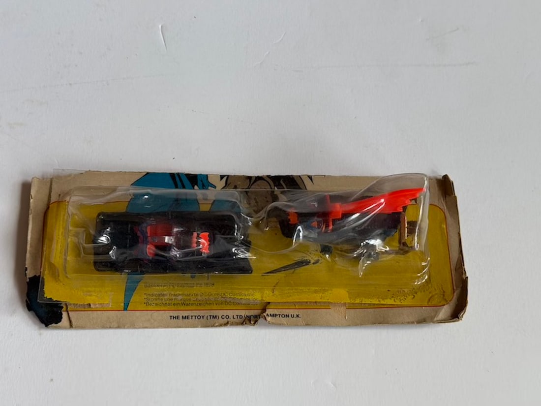 Corgi BatMobile & BatBoat on Card: Corgi BatMobile & BatBoat on Card. 1979. Made in Great Britain. The Top Half of the Card is Missing. However, the Cars are in Mint Condition.