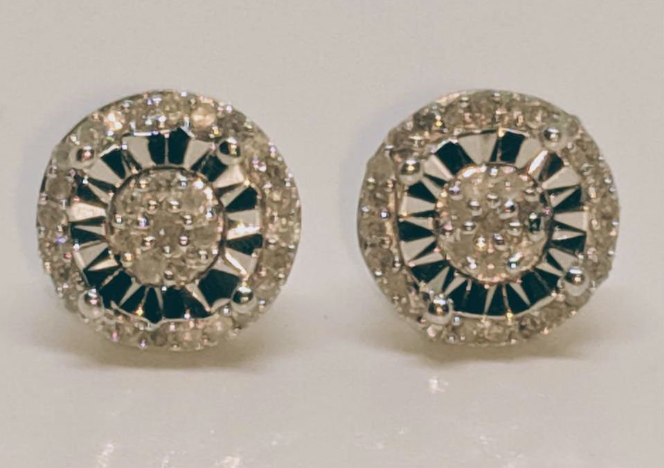 Sterling Silver Diamond Cluster Earrings: These Earrings are 8.3mm rounds with post backs. They have a cluster of 8 diamonds in the center and a halo of diamonds on the outer ring. They are stamped and tested to be 925 sterling silver