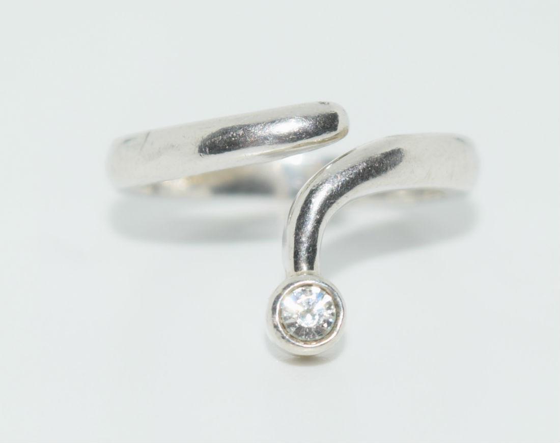 Vintage Sterling Silver Swirl Knuckle Ring: Ring is size 3.25 with a .45” drop on the face and has a dainty bezel set zirconia at the end. Stamped 925, Avon