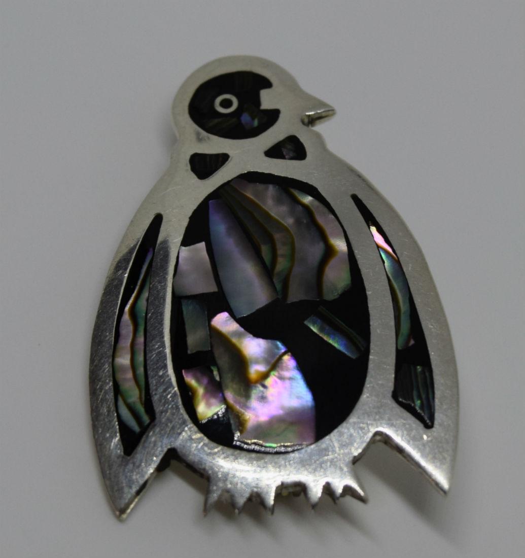Taxco Mexico Sterling Silver Penguin Pendant/Brooch: Taxco Mexico penguin brooch and pendant. This cute piece has abalone and jet set in sterling silver. It gives you the option to wear as a brooch or a pendant. Taxco is known as the silver capital of t