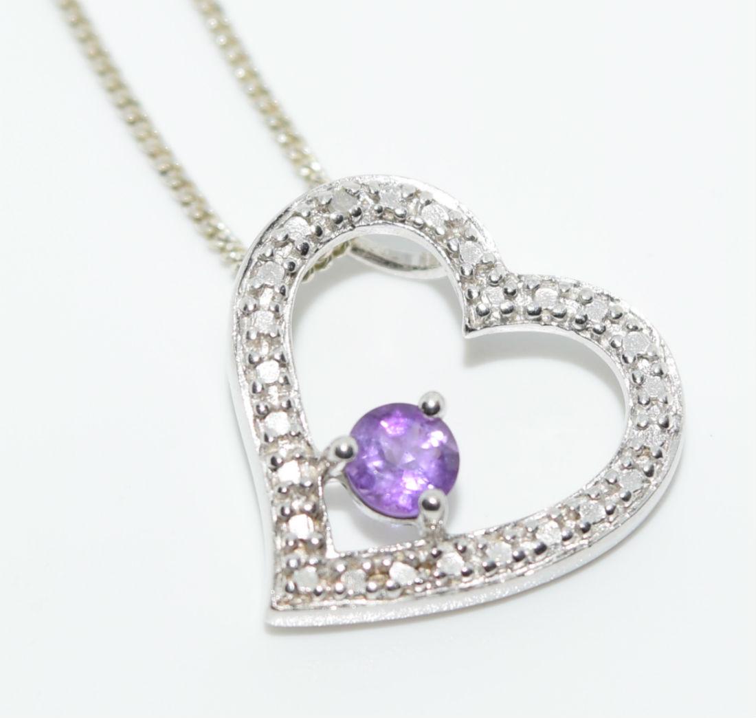 Sterling Silver Amethyst Heart Necklace: Sterling silver amethyst heart pendant necklace. | Measurement: 16” long 1mm thick 17mm pendant | Weight: 3.1 grams | Stamp: 925
