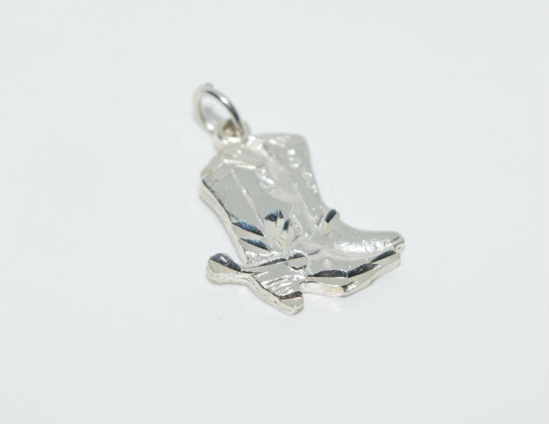 Sterling Diamond Cut Cowboy Boots Charm or Pendant: Sterling silver diamond cut cowboy boots charm or pendant | Measurement: 20mm x 16mm | Weight: 1.8 grams | Stamp: 925