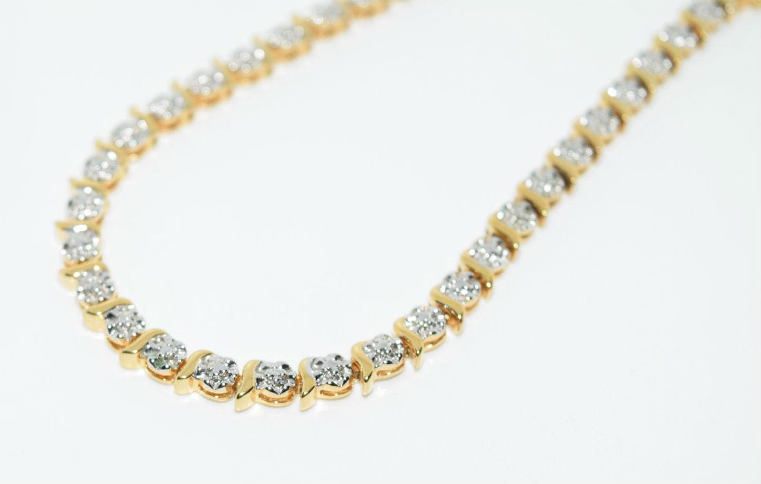 Gold Over Sterling Silver Tennis Bracelet: Gold over sterling silver tennis bracelet | Measurement: 7" length 4.5mm width | Weight: 10 grams | Stamp: 925 China