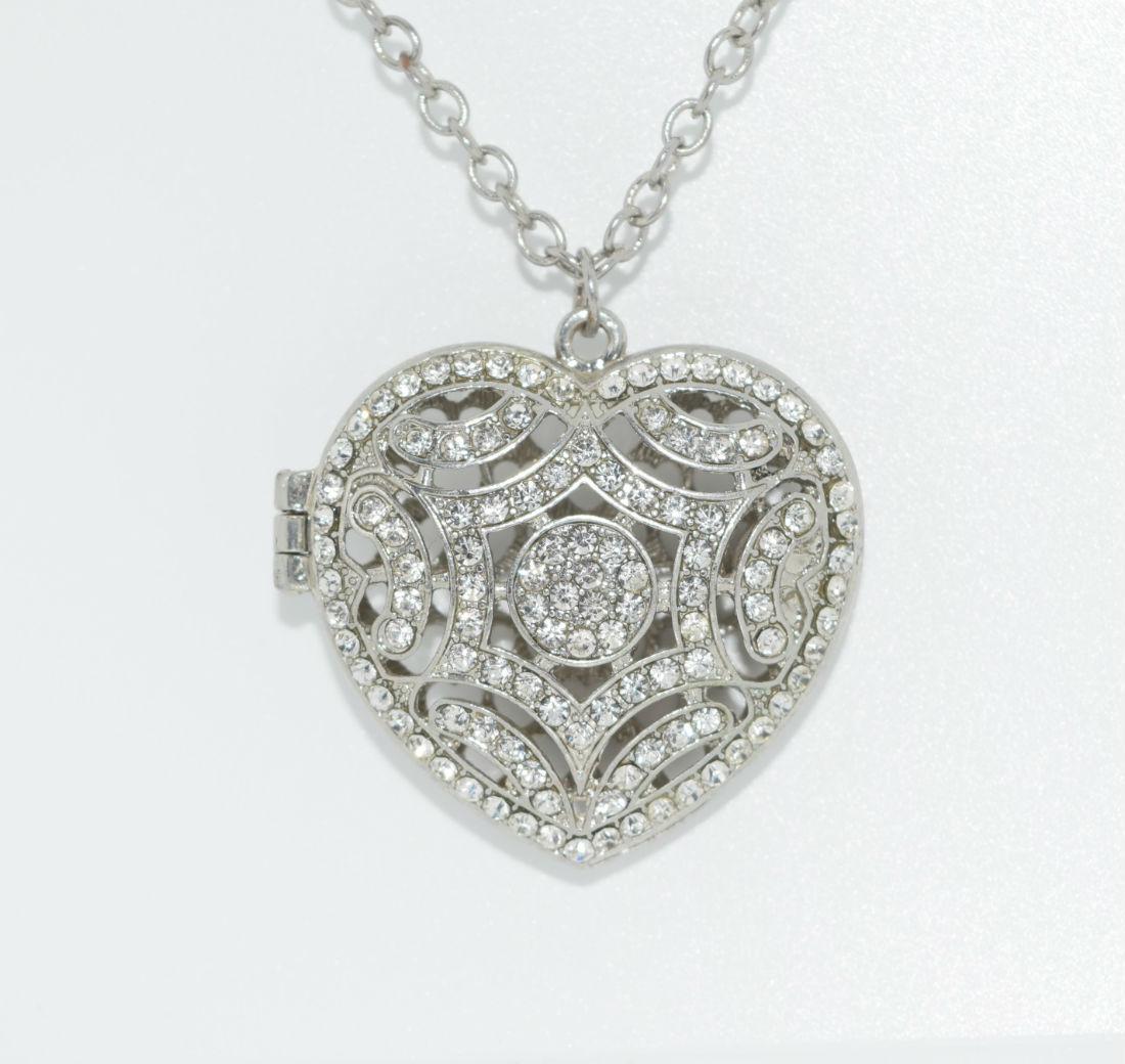 Silver Tone Rhinestone Heart Locket Pendant Necklace: Silver tone rhinestone hollow heart magnetic closure locket | Measurement: 31" - 32" length 3.7mm width, 1.8" x 1.7" pendant
