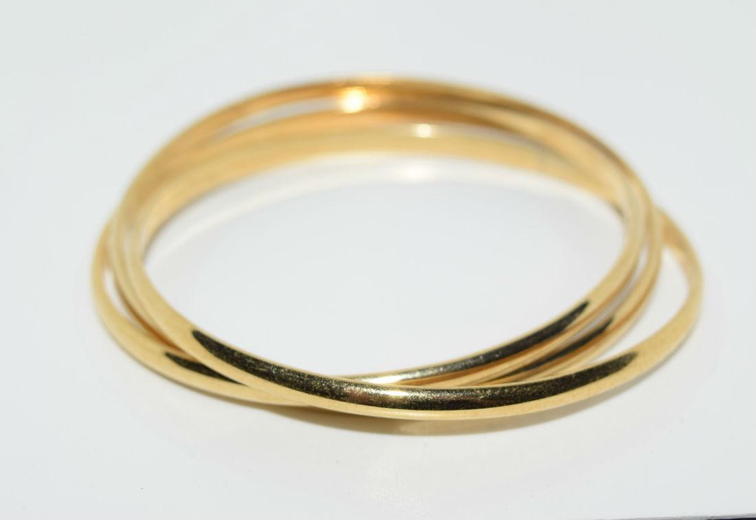 Gold Tone Triple Bangle Bracelet: Gold tone triple bangle bracelet | Measurement: 8" length 4mm width