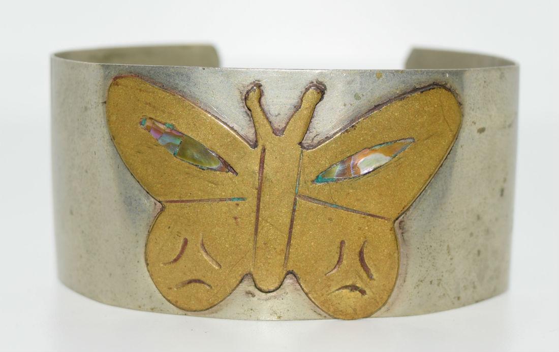 Butterfly Cuff Bracelet: Brass butterfly with abalone inlay wings set on silver tone cuff bracelet | Measurement: 6" inner circumference, 1.1" width, 1.1" opening