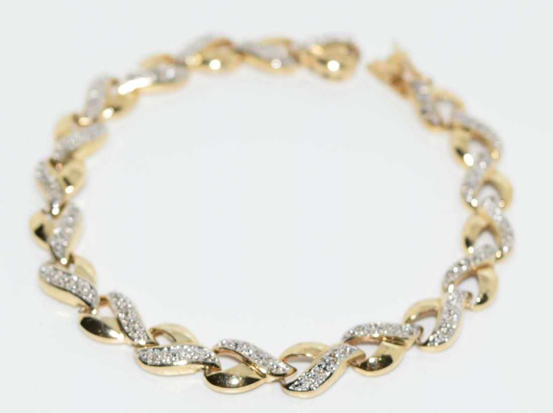 Gold Over Sterling Silver Diamond Tennis Bracelet: Gold over sterling silver diamond tennis bracelet | Measurement: 7" long 7.5mm width | Weight: 12.7 grams | Stamp: 925