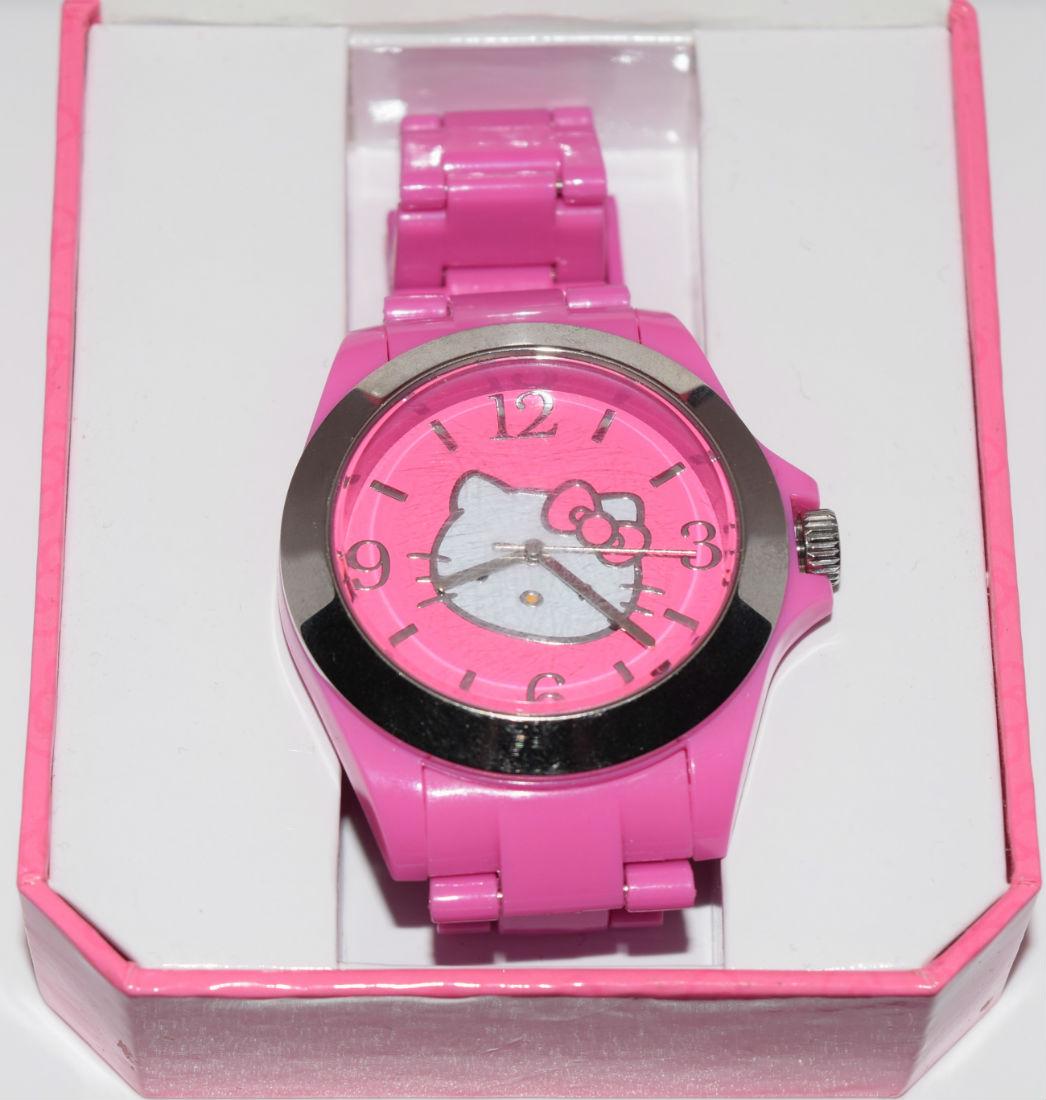 Sanrio Hello Kitty Pink Plastic Band Watch New Battery: Sanrio Hello Kitty pink plastic band watch with new battery. comes with original box | Measurement: 7" inner circumference 1.5" x 1.7" face | Note: there are scratches on the face