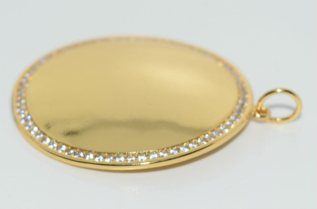 Gold Over Sterling Silver Dome Pendant: This pendant has a 46mm drop and is 39mm round. Has an outer layer of zirconia stones. Stamped AV 925