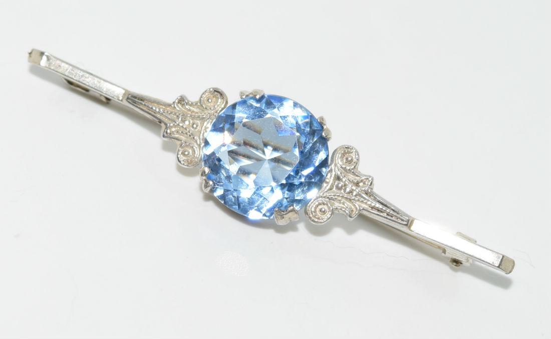 Vintage 800 Silver Blue Stone Brooch: This piece measures 51.5x12mm and the stone is 12mm round. Stone is unknown. At the edge of the brooch is a stamped but cannot make it out. When tested it came back as 800 silver