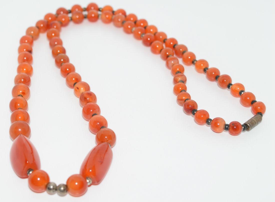 Vintage Carnelian Graduating Stone Necklace: This necklace is 26” long with stones ranging from 6.5-.mm rounds with 2 elongated 21mm stones towards the bottom.