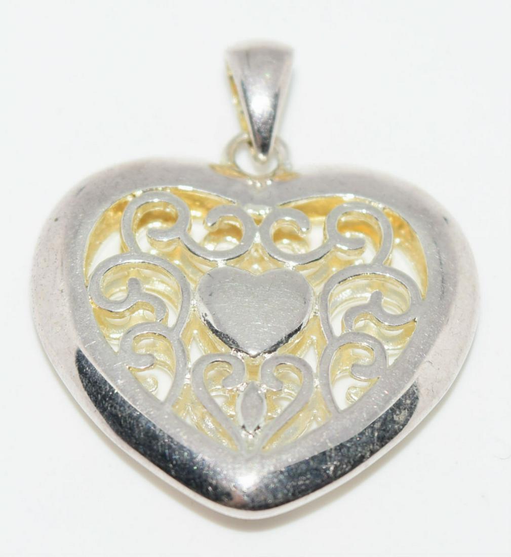 Sterling Silver Heart Pendant: This pendant has a 1.32” drop and is signed and stamped 925