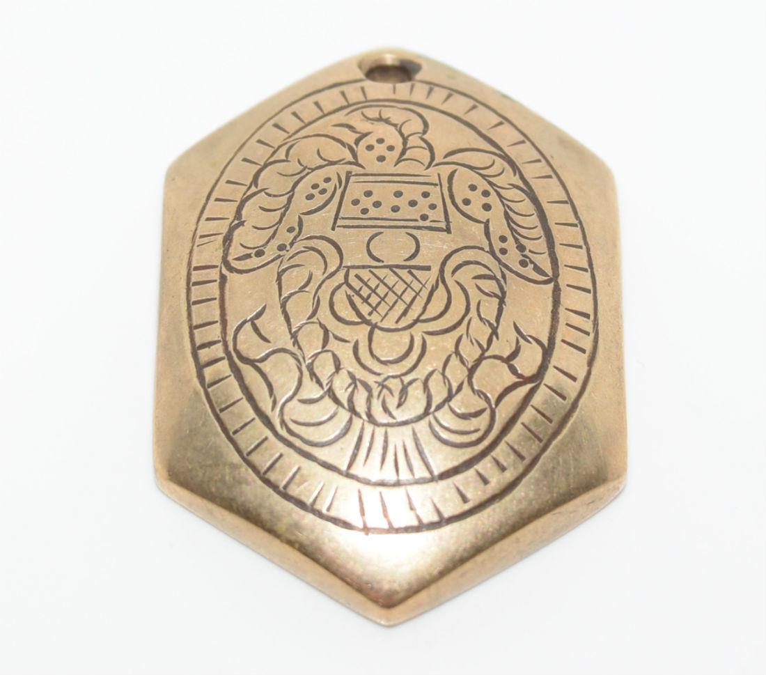Vintage Detailed Carved Brass Medallion Style Trinket: This piece is 1.40" by .95" wide and is .25" thick. It weighs 27.8 grams. Can be made into a pendant
