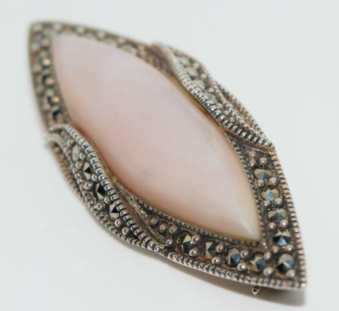 Vintage Sterling Marcasite & Mother of Pearl Brooch: This brooch measures 50.3 x 18.7 mm wide. Stamped 925 and tested to be at least 925 sterling silver.