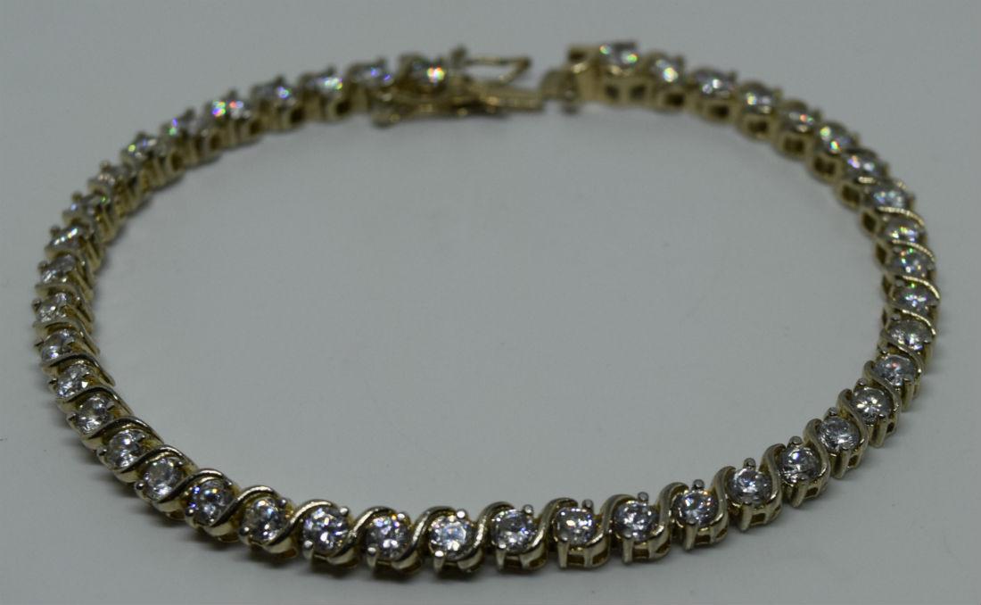 Sterling Silver CZ Tennis Bracelet: This bracelet is 7.5” long and is stamped 925 for sterling silver.