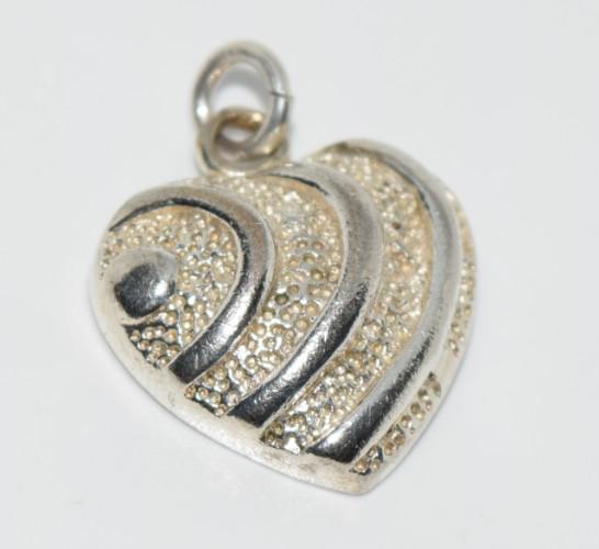Simple Sterling Silver Heart Pendant: This pendant measures 21.2x19mm and is stamped 925.