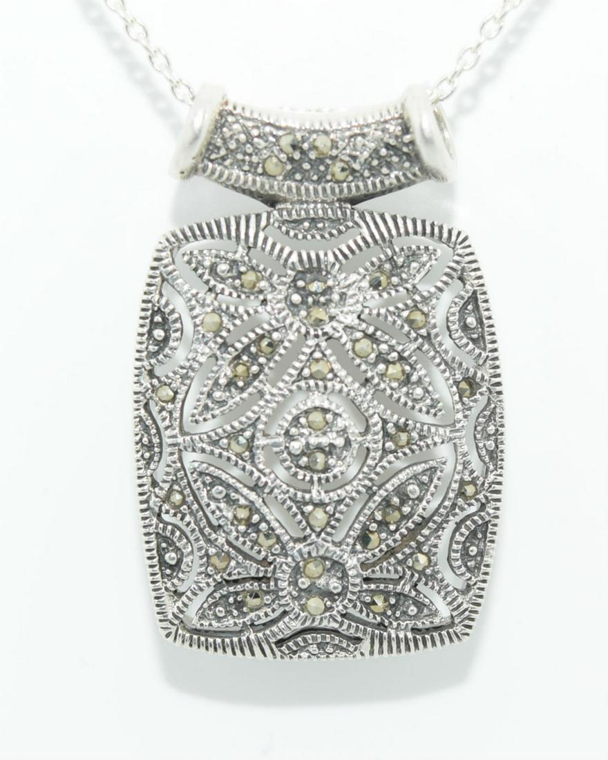 Sterling Brilliant Marcasite Floral Design Necklace: Sterling Silver & Marcasite Measures 23mm Wide with a 35.3mm Drop on a 18” Chain