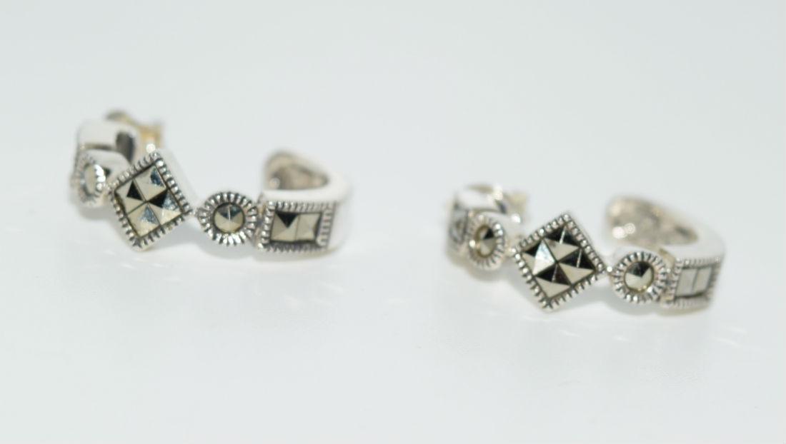 Sterling Silver Marcasite Curved Post Earrings: Sterling Silver & Marcasite curved post earrings measures 6.5mm wide with a 18mm drop