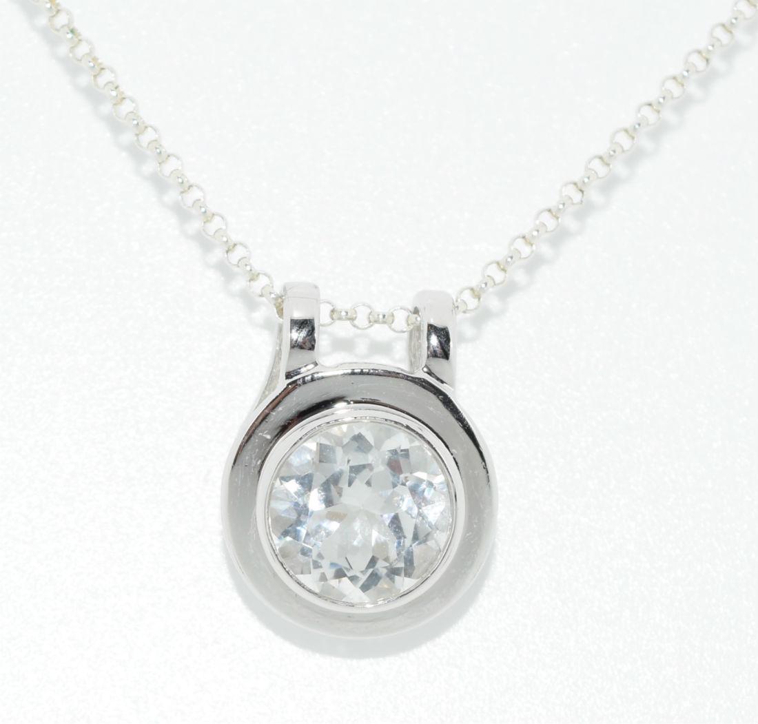 Sterling Cubic Zirconia Circle Pendant Necklace: Sterling silver cubic zirconia circle pendant rolo chain necklace | Measurement: 17" long 1.5mm thick necklace, 18mm pendant drop | Weight: 6.2 grams | Stamp: 925