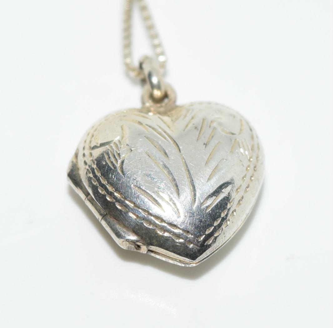 Vintage Sterling Silver Heart Locket Necklace: Sterling Silver Heart Locket measures 16mm with a 20mm Drop on a 18” Necklace