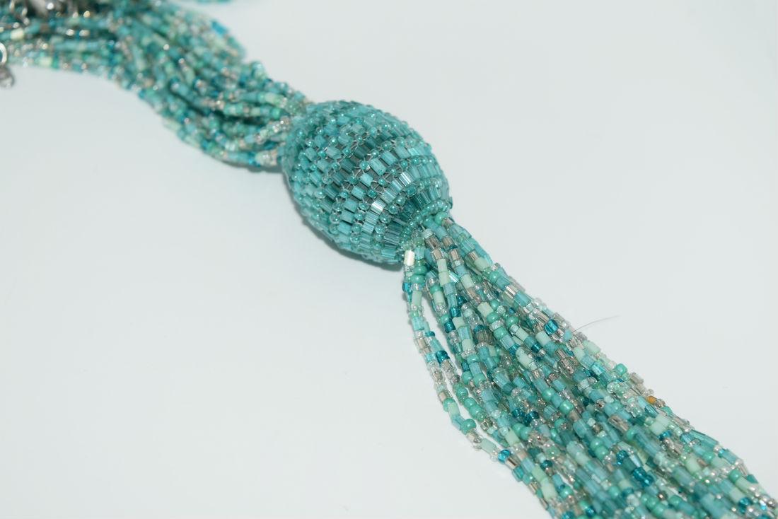 Teal & white bead tassel necklace: Teal & white bead tassel necklace | Measurement: 25” â€“ 28” length, 8” pendant drop