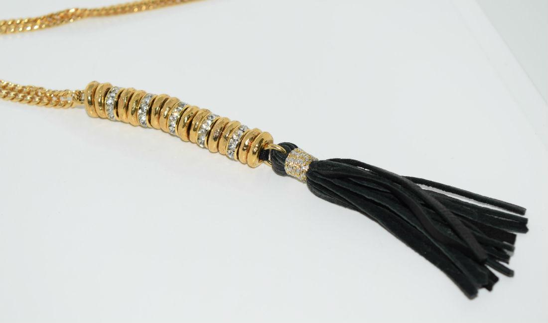 Gold tone rhinestone tassel necklace: Gold tone rhinestone tassel necklace | Measurement: 32” length 5” pendant drop
