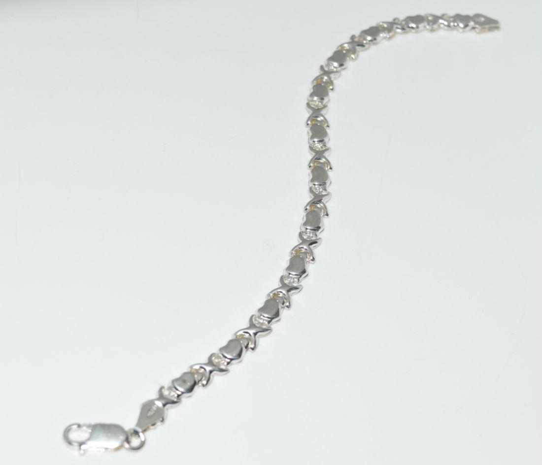 Sterling Heart & Cross linked Tennis Bracelet: Thin Sterling Heart Link Bracelet measure 6mm wide and 7 Inches Long