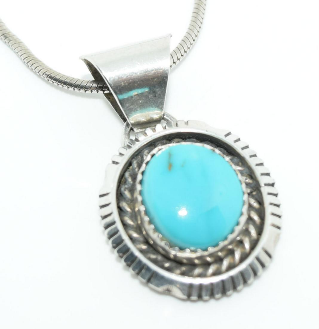 Sterling Silver Bezel Set Turquoise Necklace: This Turquoise Natural Stone is bezel set measuring app 11mm x 10mm on a 19mm with a 32mm Drop Pendant on a 1.4mm 16inch Snake Chain and Weighs a Whopping 13.21 Grams.