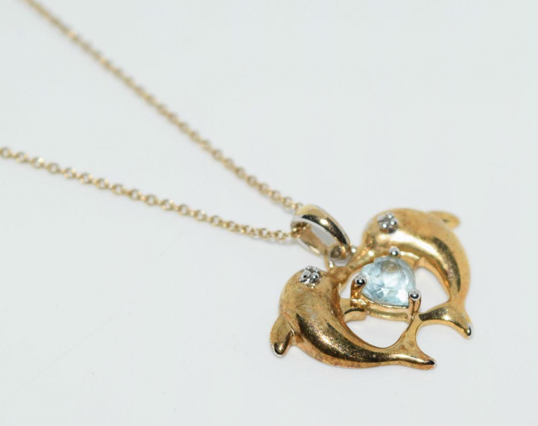 Gold Over Sterling Topaz Dolphin Necklace: Gold over sterling silver topaz dolphin pendant necklace | Measurement: 18” length, 18mm pendant drop, 23mm width