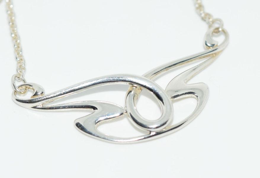 Sterling Silver Tribal Design Necklace: This Sterling Silver Tribal Design Pendant Necklace measures 40mm x 19mm and is stamped 925 mg on a 16inch link chain with a 2inch extension.