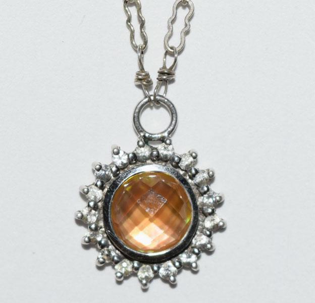 Sterling Yellow Stone Halo Necklace: This Sterling Silver Stone Accent Halo Necklace measures 14.3mm round Pendant with a 7.5mm Yellow Faceted Stone with 1.5mm round halo style stones on a 19inch unique Link Chain and is stamped CS 925.