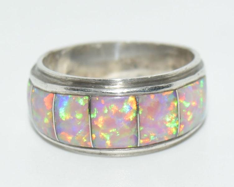 VTG Sterling Opal channel Inlaid Ring: Vintage Sterling Silver Size 9 ring is 10mm wide with pink opal channel inlaid and weighs 6.12 Grams.