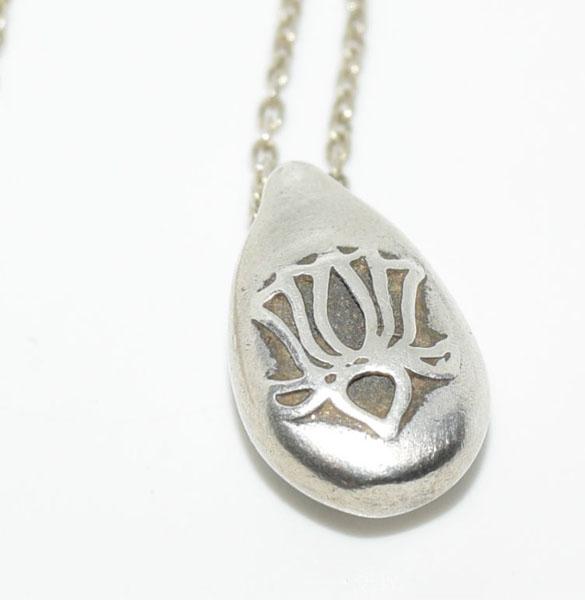 Sterling Tear Drop Lotus Flower Necklace: This Sterling Silver lotus flower pendant measures 14.7 x 9.3mm on a 18inch chain and is stamped 925 SATYA.