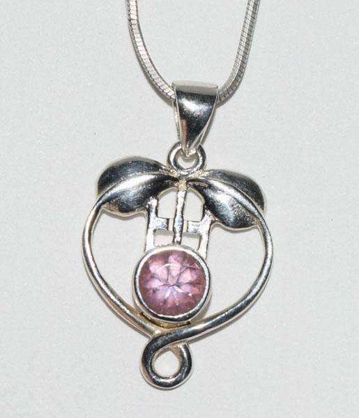 Sterling Silver Purple Stone Necklace: This Sterling Silver Unique Design pendant measures 17.2mm wide with a 27.5mm drop on a 18inch snake chain with a Bezel set Purple Cz Stone.