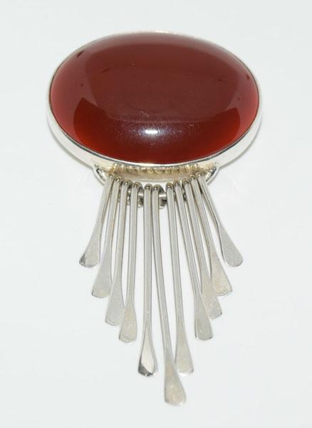 Mexico Sterling Carnelian Stone Pendant/Pin: This Bold Oval Carnelian Stone Mexico Sterling Silver Brooch / Pendant is 41mm wide with a 76.5mm drop and is stamped Mexico AIS. It also weighs an impressive 28.73 Grams.