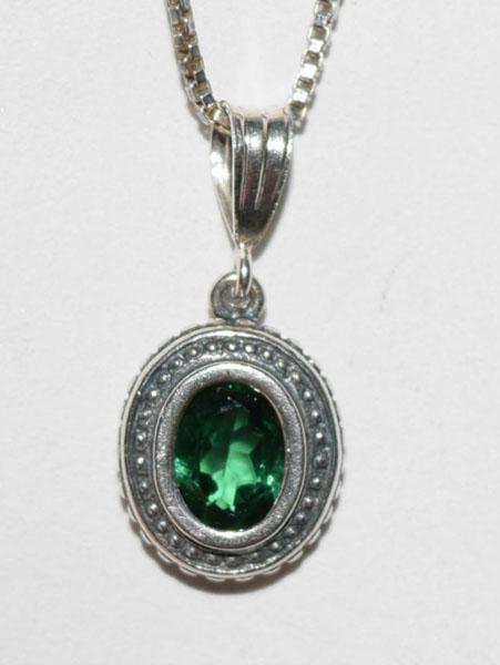 Sterling Silver Spinel Oval necklace: This Sterling Silver 19inch box chain has a 10.5mm wide 22mm drop oval pendant with a green spinel stone. The Necklace is stamped 925 SC and weighs 5 grams.