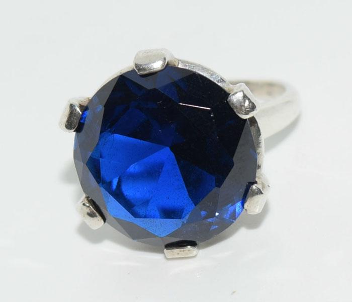 Vtg Large Sterling Synthetic Sapphire Ring sz 5: This Sterling Silver 6 Prong Size 5 Ring has a Large Synthetic Royal Blue 16mm Sapphire Solitaire.
