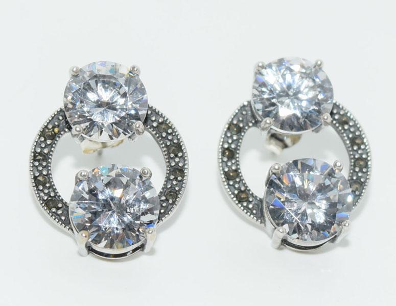 VTG Sterling Large Cz Earrings: These Vintage earrings measure 18.2mm wide with a 22.7mm drop with 9.5mm Cz stones and marcasite accents. These earrings are stamped 925 SM.