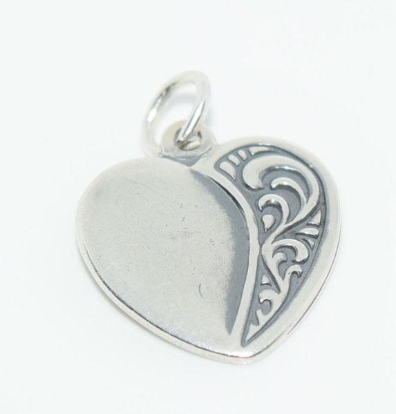 Sterling Silver Scroll Heart Charm: This Sterling Silver Heart charm has a scroll design on one side and measures 17.4 x 15.5mm and is stamped sterling.
